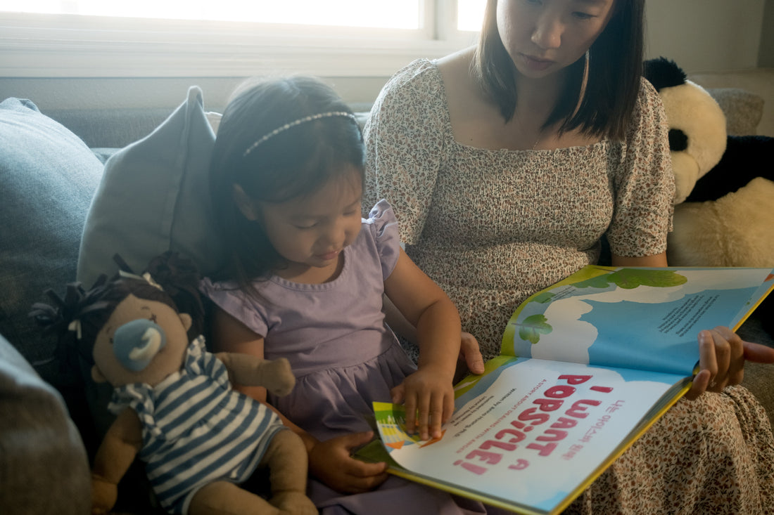 A mother and daughter reading I Want A Popsicle!, a bilingual preschool book about anger